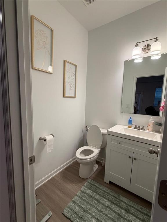 5790 Flint Lane Cumming, GA 30028 - Photo 27 of 40 a bathroom with a toilet sink and mirror