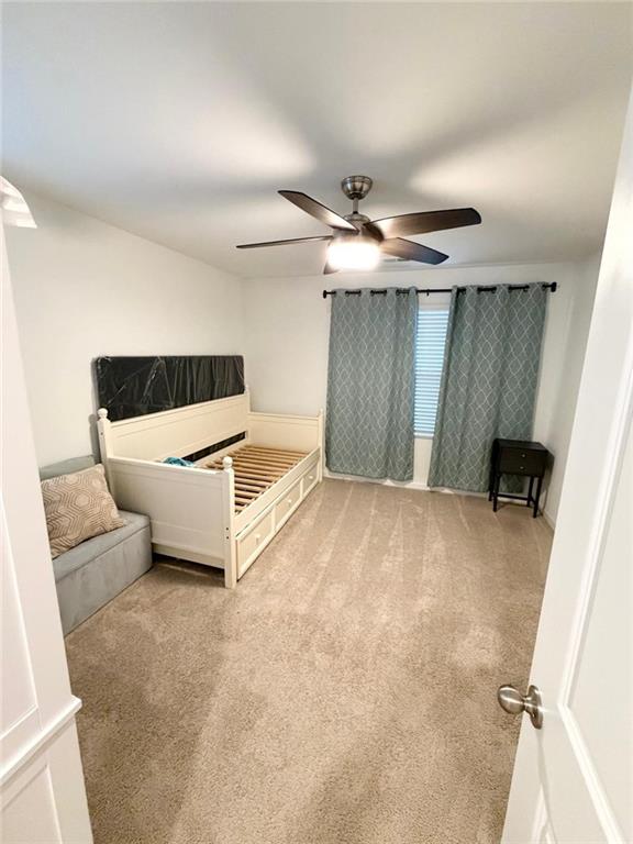5790 Flint Lane Cumming, GA 30028 - Photo 30 of 40 a view of a livingroom with furniture and a ceiling fan