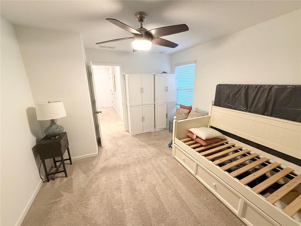 5790 Flint Lane Cumming, GA 30028 - Photo 31 of 40 a living room with furniture and a chandelier