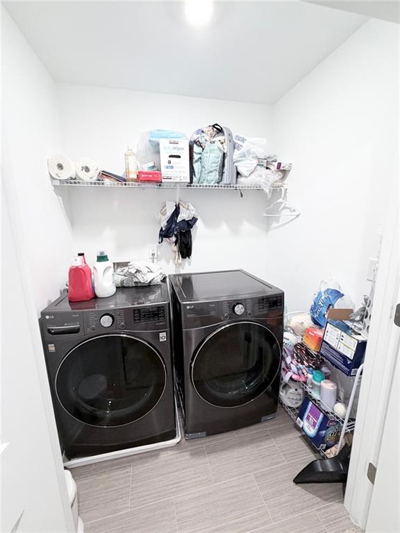 5790 Flint Lane Cumming, GA 30028 - Photo 34 of 40 a utility room with dryer and washer