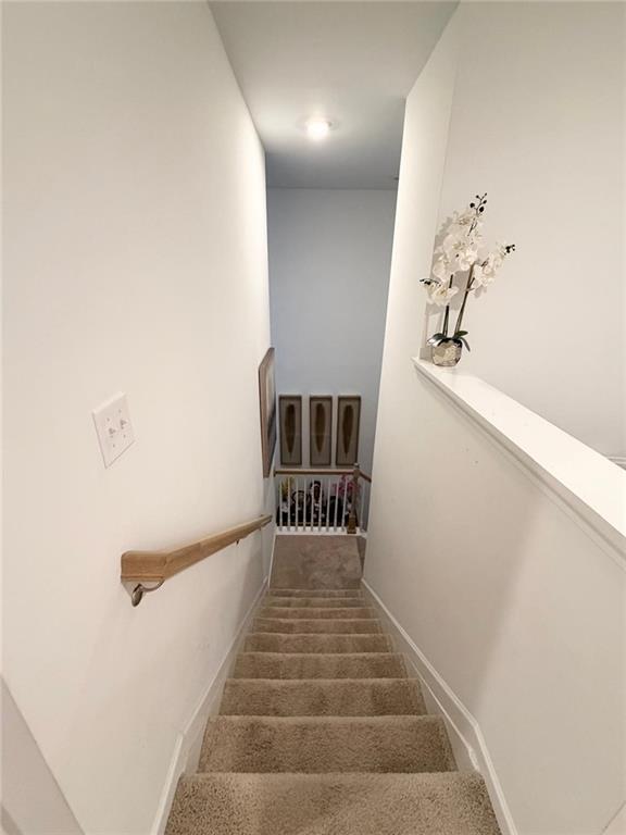 5790 Flint Lane Cumming, GA 30028 - Photo 35 of 40 a view of a hallway with staircase