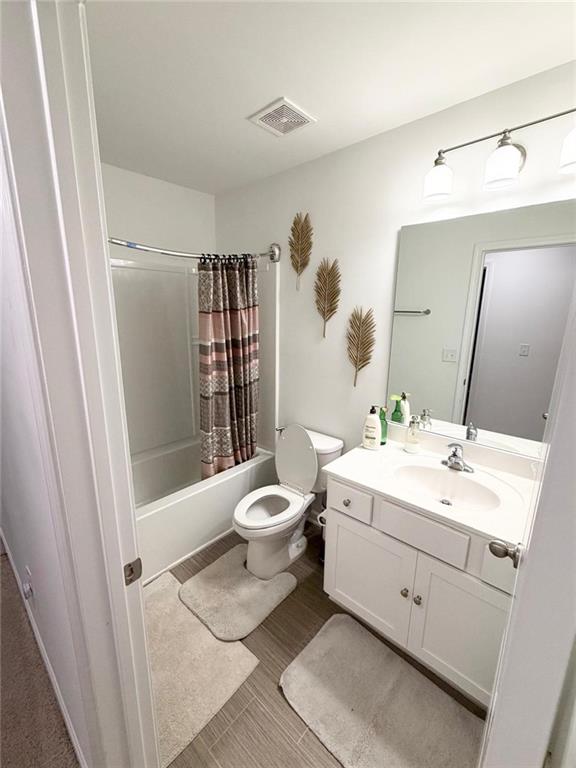 5790 Flint Lane Cumming, GA 30028 - Photo 36 of 40 a bathroom with a double vanity sink toilet mirror and shower