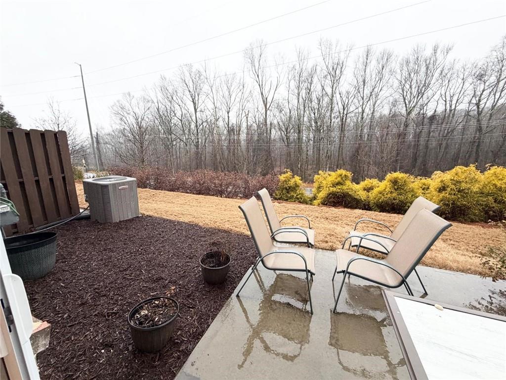 5790 Flint Lane Cumming, GA 30028 - Photo 39 of 40 a view of backyard with seating space and trees