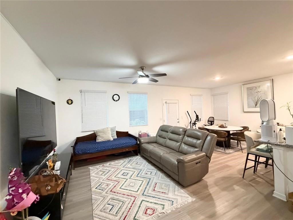 5790 Flint Lane Cumming, GA 30028 - Photo 6 of 40 a living room with furniture and a flat screen tv