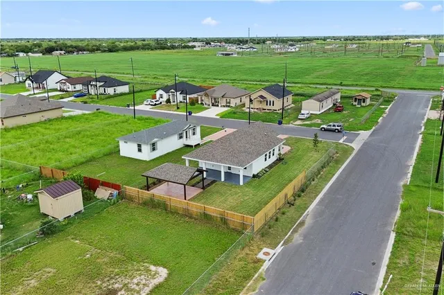 swimming pool view with a garden