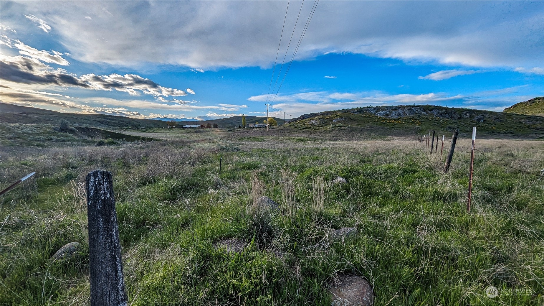 255 Riverside Cutoff Road Riverside, WA 98849 - Photo 22 of 40 a view of a yard with a mountain