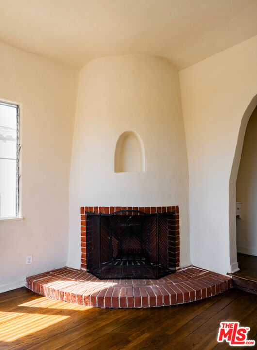 8221 West 4th Street Los Angeles, CA 90048 - Photo 7 of 21 a living room with furniture a flat screen tv and a fireplace