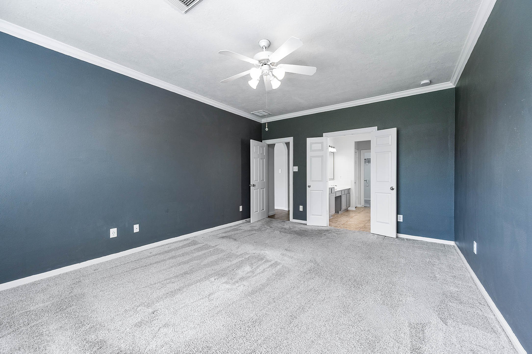 6411 Greencreek Meadows Lane Spring, TX 77379 - Photo 21 of 39 a view of an empty room with a ceiling fan