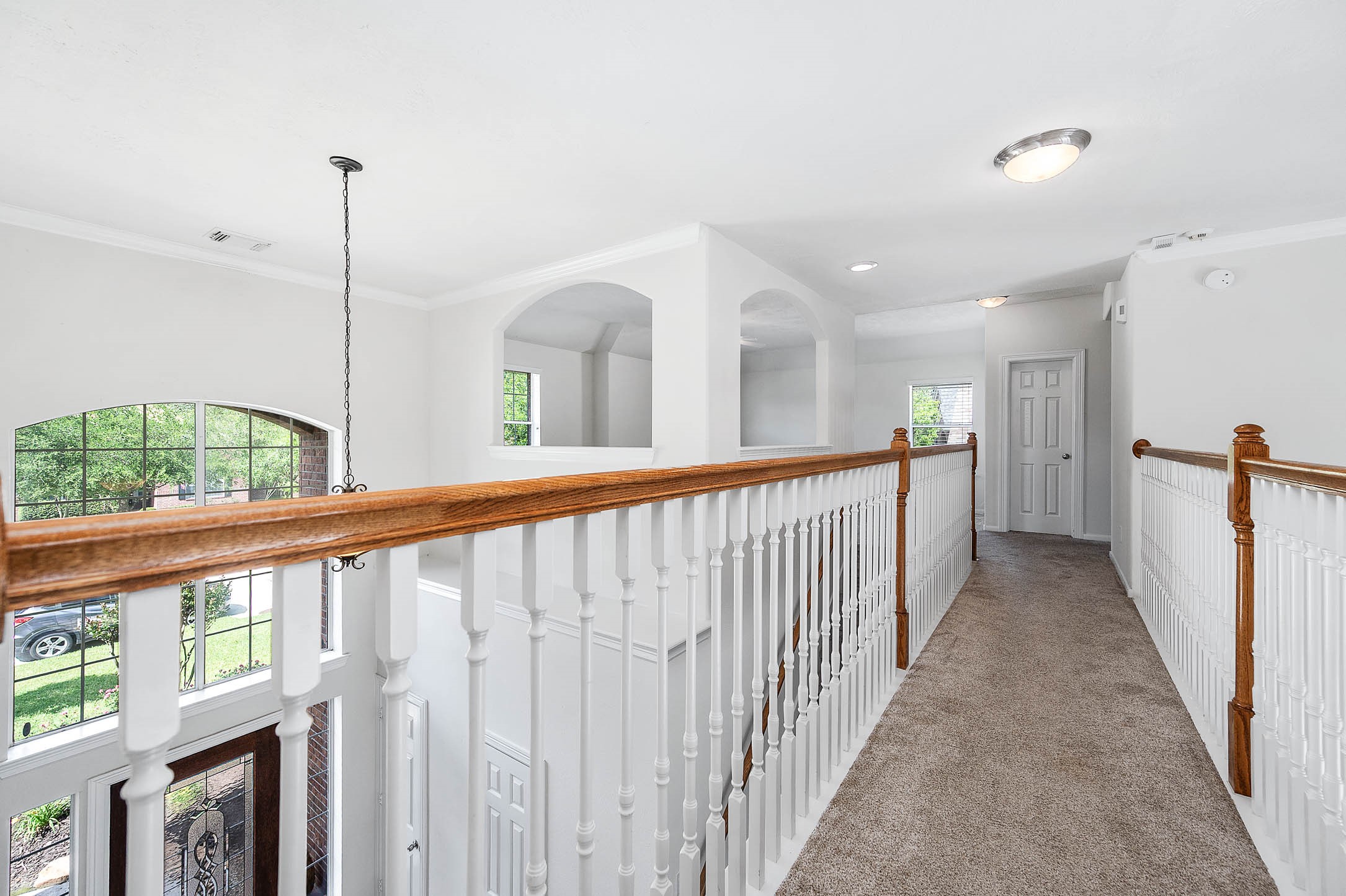 6411 Greencreek Meadows Lane Spring, TX 77379 - Photo 26 of 39 a view of a hallway with windows