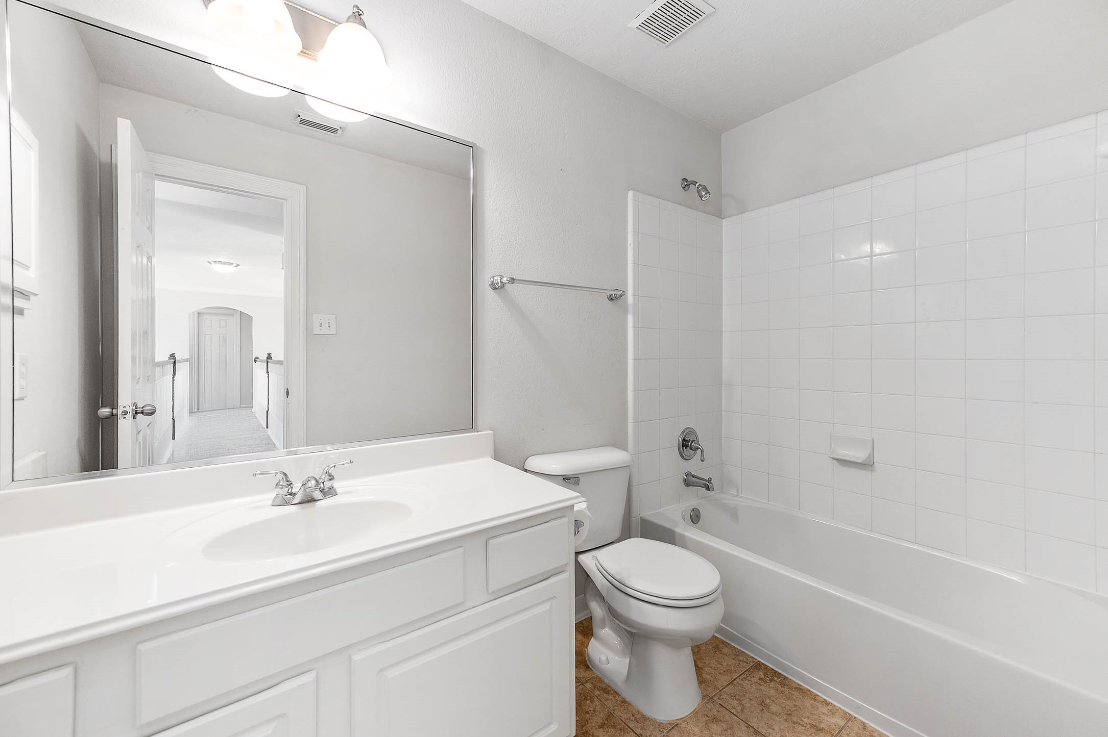 6411 Greencreek Meadows Lane Spring, TX 77379 - Photo 29 of 39 a bathroom with a sink a toilet and shower