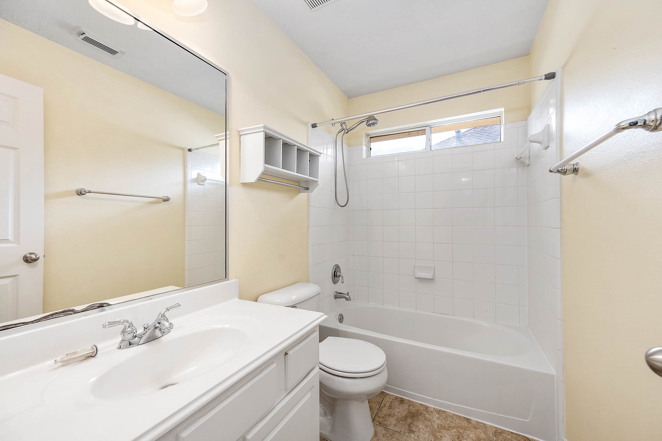 6411 Greencreek Meadows Lane Spring, TX 77379 - Photo 32 of 39 a bathroom with a sink mirror toilet and bathtub