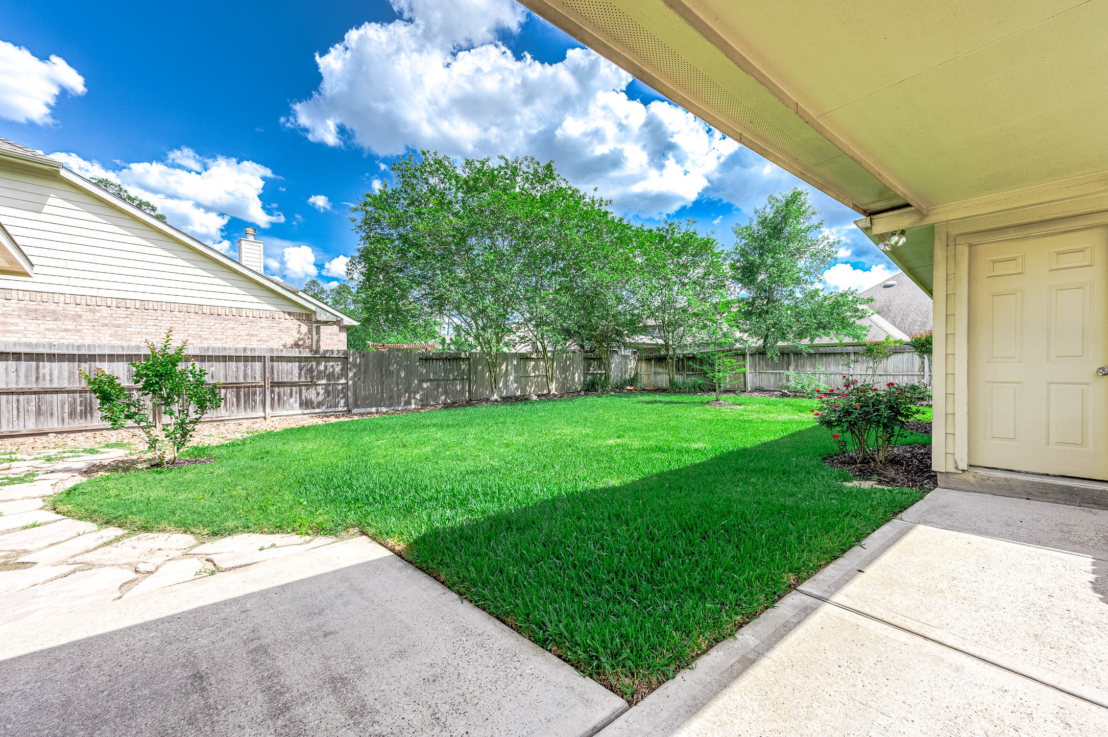 6411 Greencreek Meadows Lane Spring, TX 77379 - Photo 36 of 39 a view of a backyard with a garden