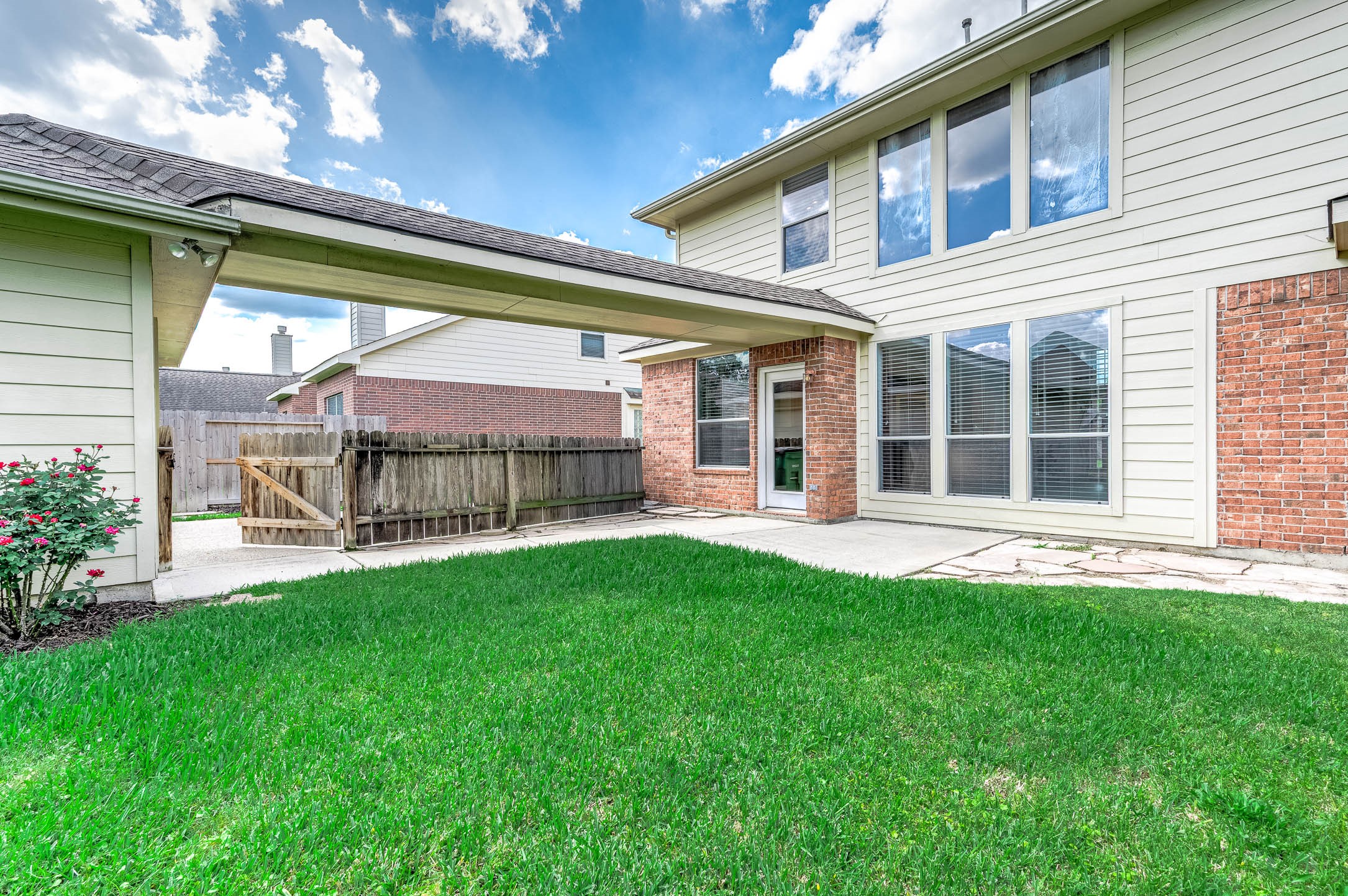 6411 Greencreek Meadows Lane Spring, TX 77379 - Photo 39 of 39 a view of a house with a backyard porch and sitting area