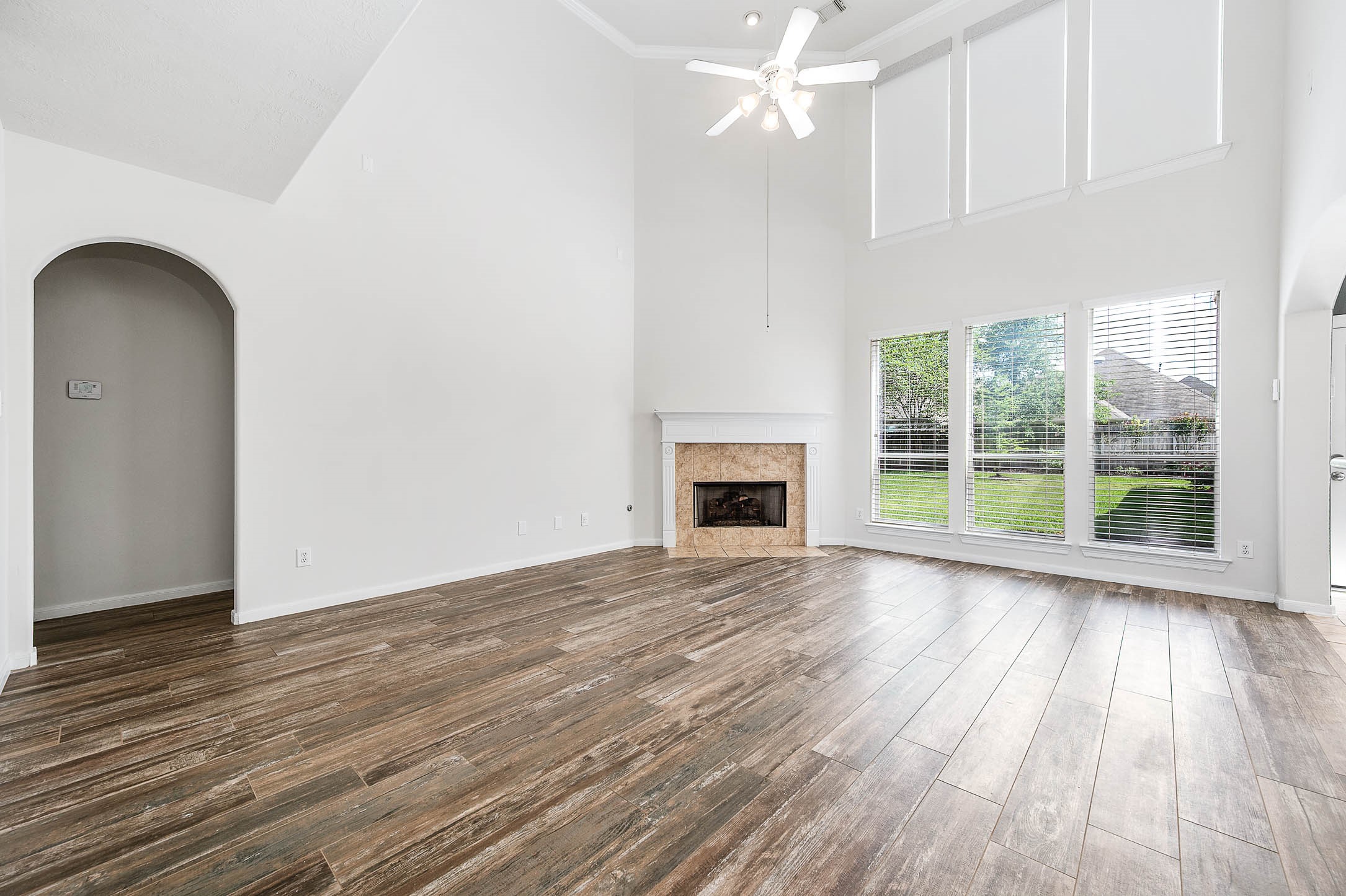 6411 Greencreek Meadows Lane Spring, TX 77379 - Photo 9 of 39 a view of empty room with wooden floor and fan