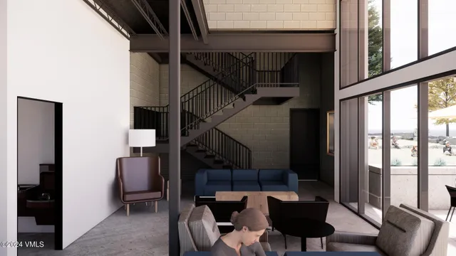 a view of a livingroom with furniture and window