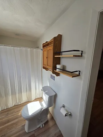 a bathroom with a shower and a bath tub