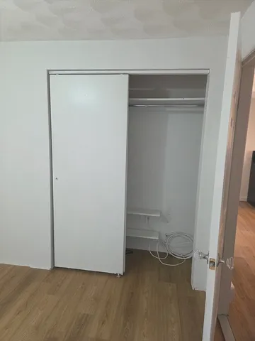 a view of a car parked front of a house