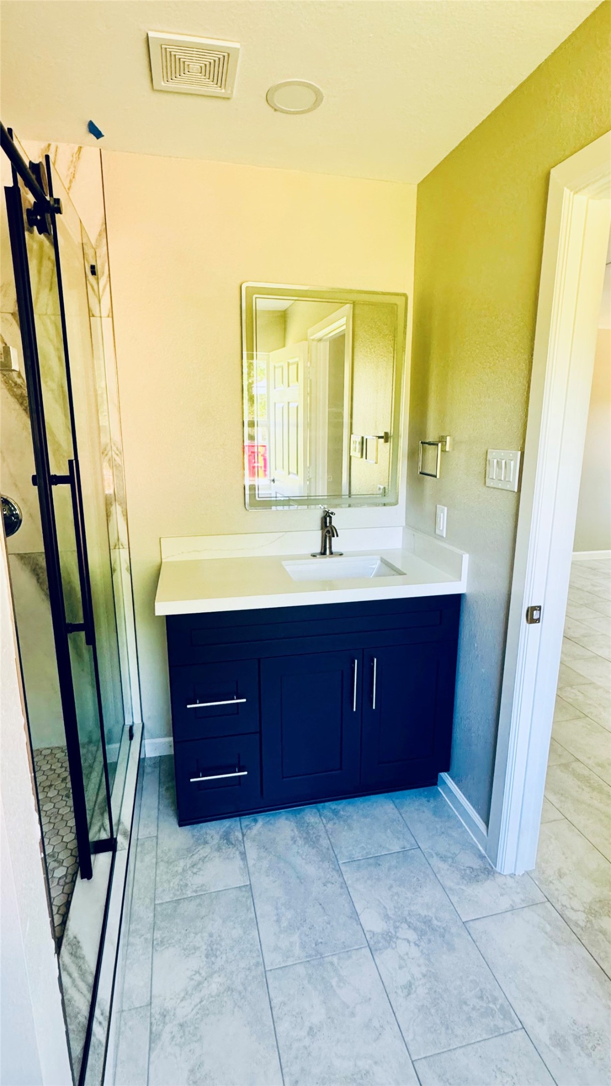 1434 County Road 878A Sweeny, TX 77480 - Photo 30 of 36 a bathroom with a double vanity sink and a mirror