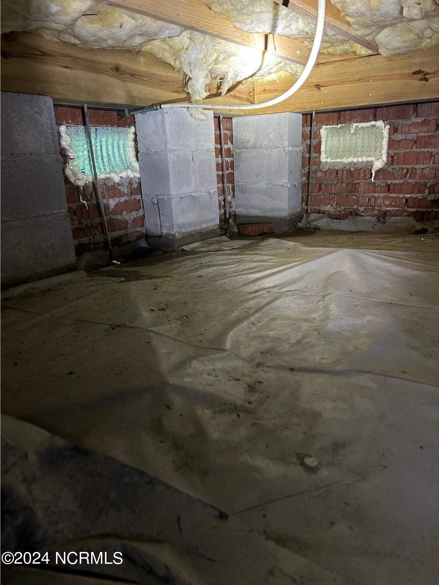 1213 Brickhouse Point Road Elizabeth City, NC 27909 - Photo 43 of 45 Crawlspace and Moisture Barrier