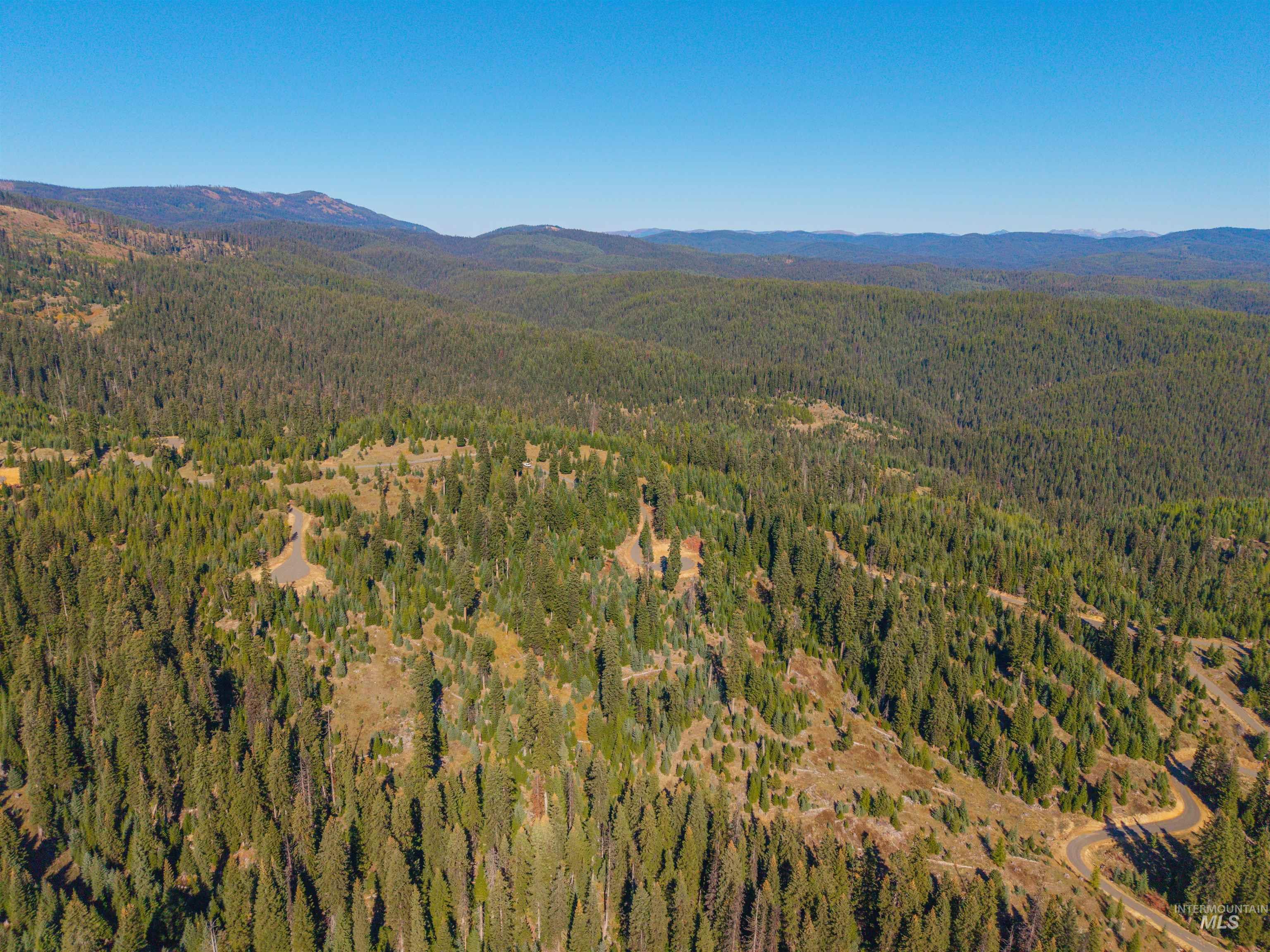 4 Tree Farm Trails Road Elk City, ID 83525 - Photo 14 of 17 View of property location featuring mountains and a forest