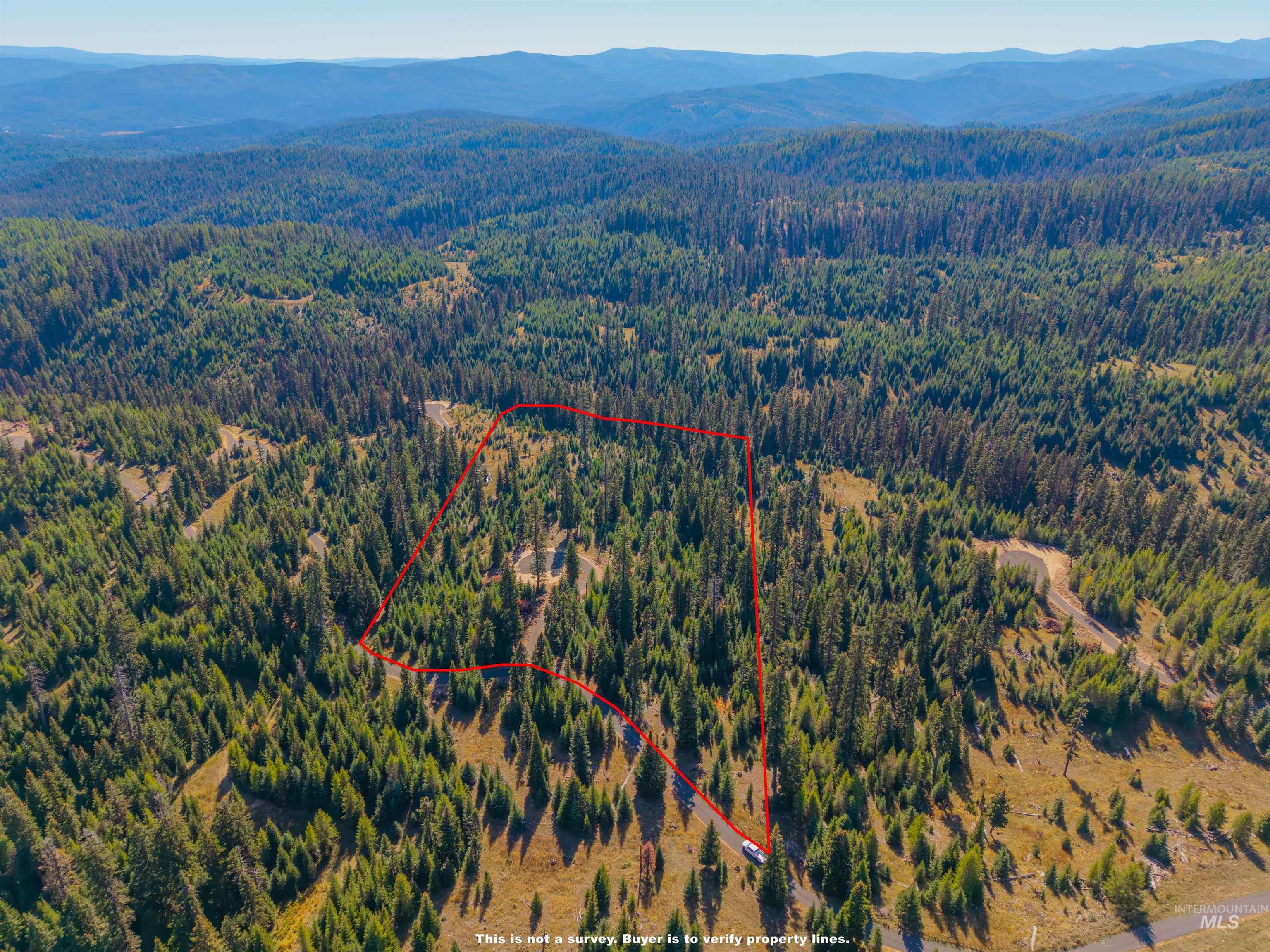 4 Tree Farm Trails Road Elk City, ID 83525 - Photo 8 of 17 Aerial view of property's location featuring a mountainous background and property parcel outlined