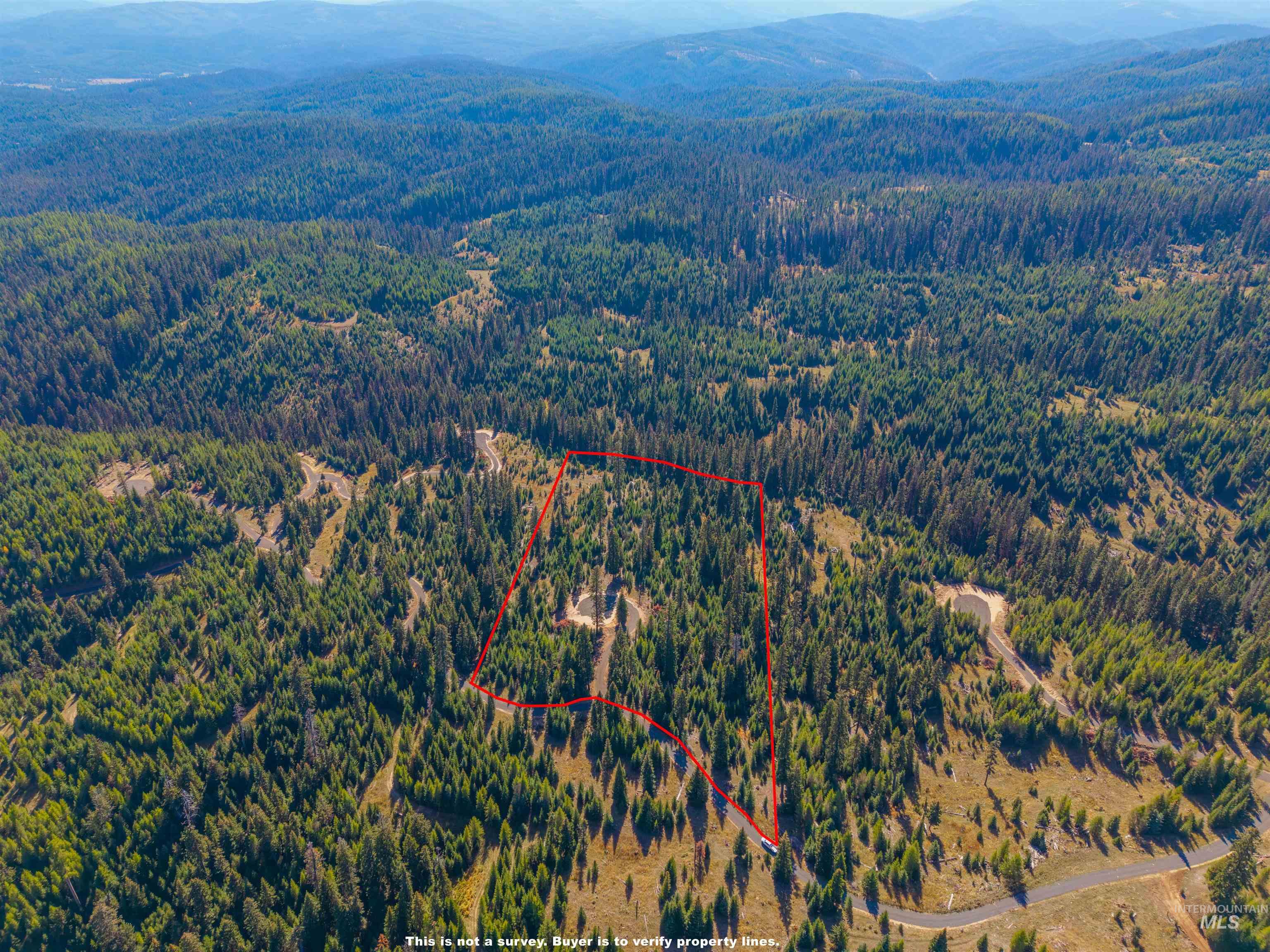 4 Tree Farm Trails Road Elk City, ID 83525 - Photo 9 of 17 Aerial overview of property's location featuring property parcel outlined and a mountain backdrop