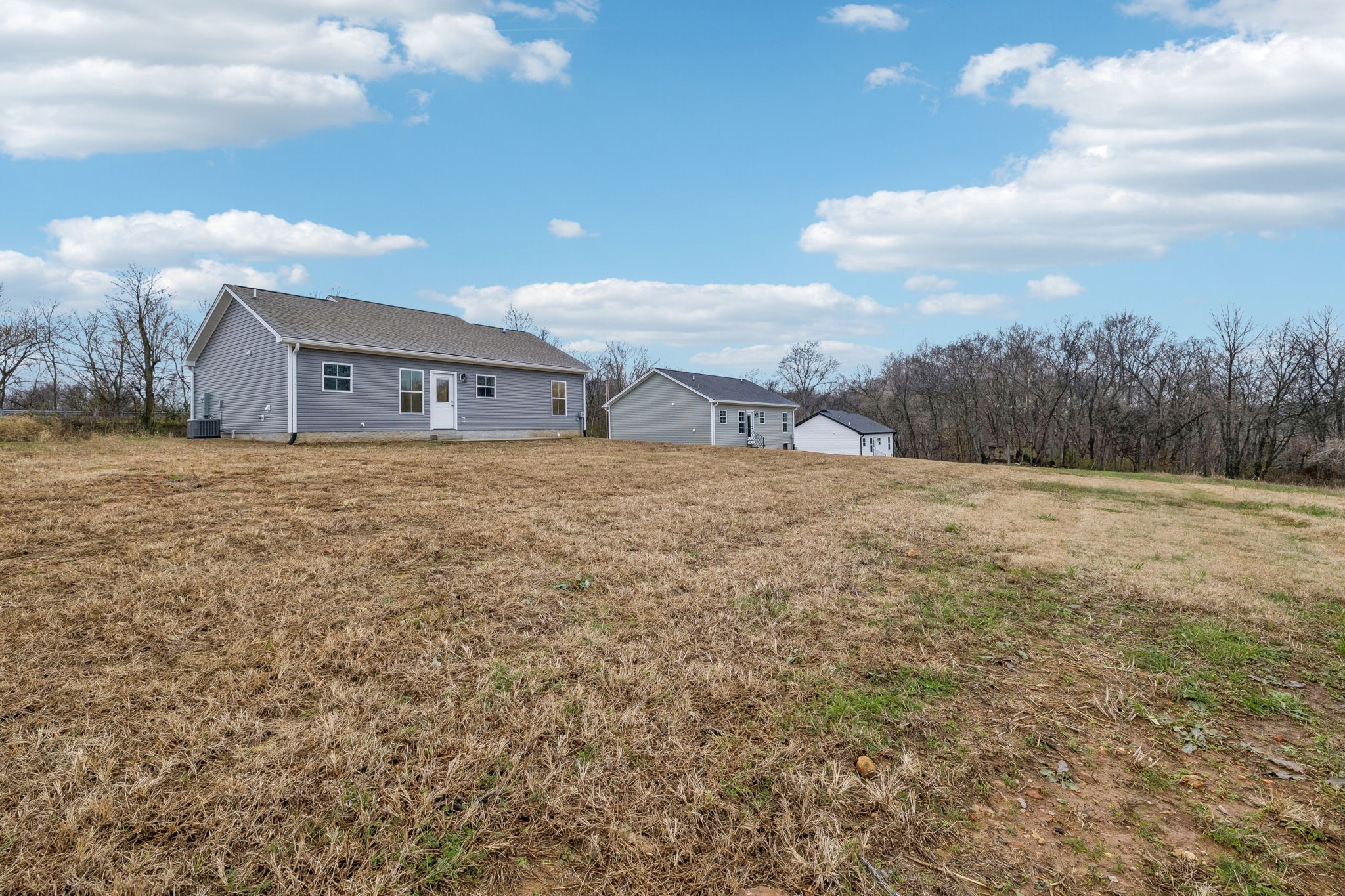 1073 Landing Lane Adams, TN 37010 - Photo 28 of 28 a view of a house with a yard