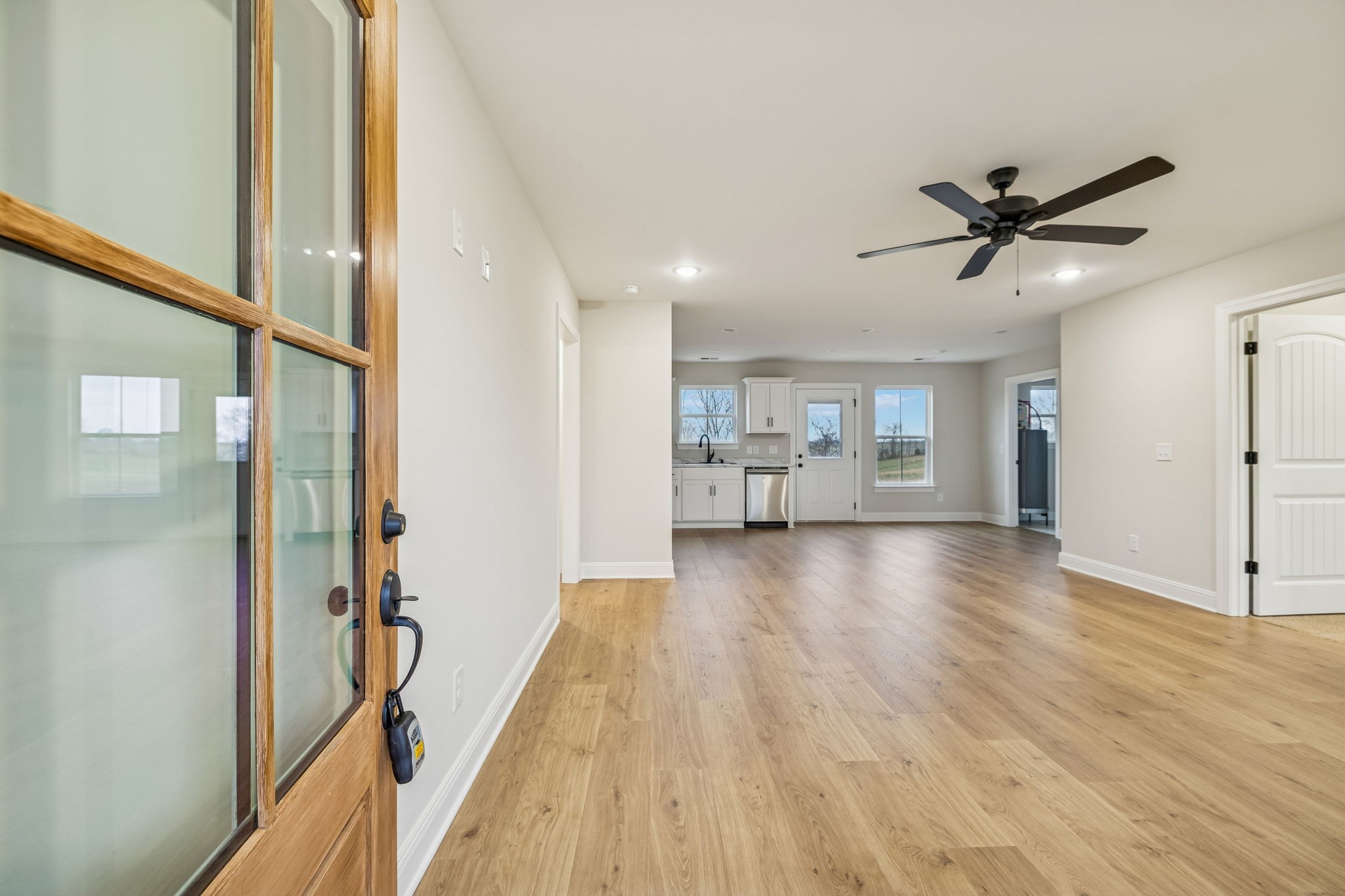 1073 Landing Lane Adams, TN 37010 - Photo 5 of 28 a view of a kitchen with a sink and wooden floor