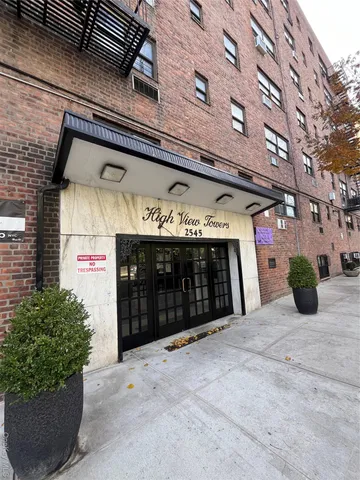 a view of a building with a garage