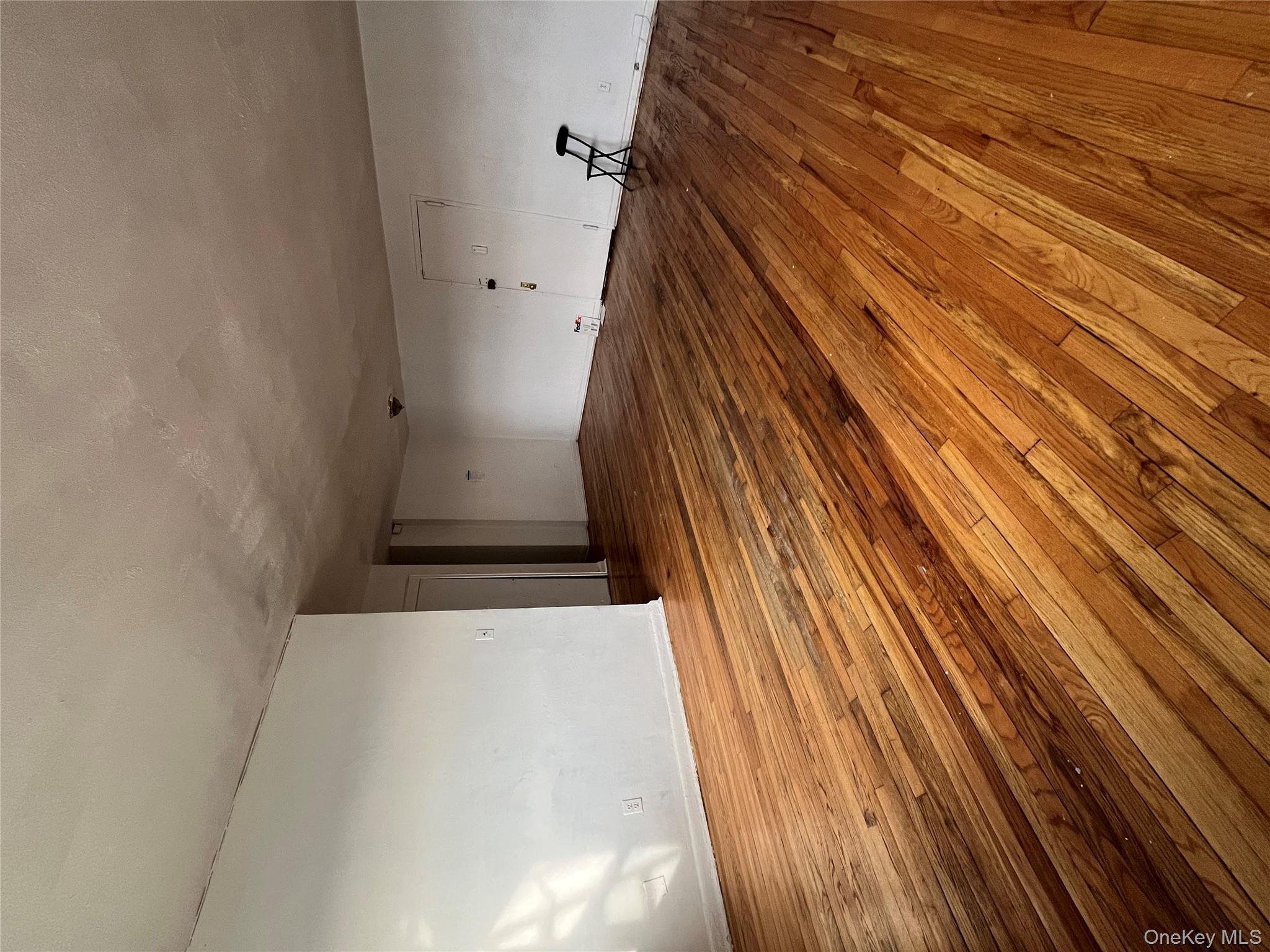 2545 Sedgwick Avenue, Unit 7B Bronx, NY 10468 - Photo 11 of 20 a view of empty room with wooden floor