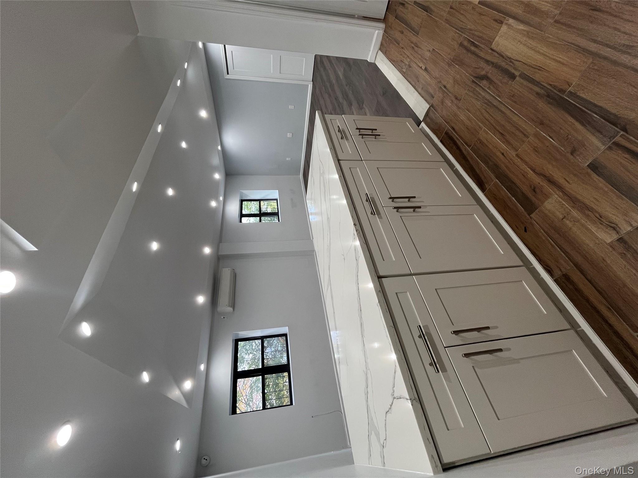 2545 Sedgwick Avenue, Unit 7B Bronx, NY 10468 - Photo 20 of 20 a view of a kitchen with a sink and dishwasher with wooden floor