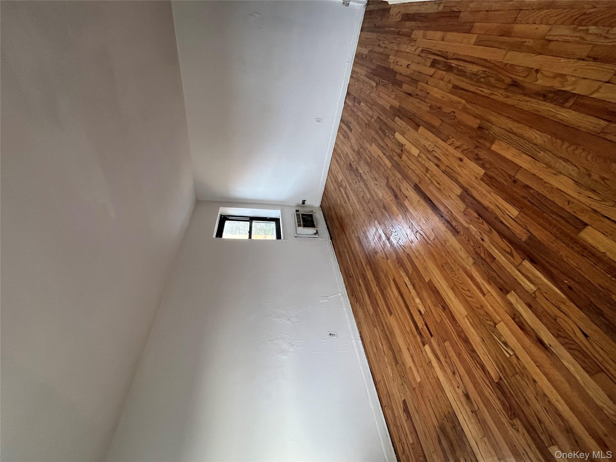 2545 Sedgwick Avenue, Unit 7B Bronx, NY 10468 - Photo 5 of 20 a view of empty room with wooden floor and fan