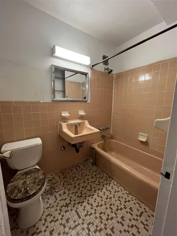 a kitchen with stainless steel appliances granite countertop a sink and a stove