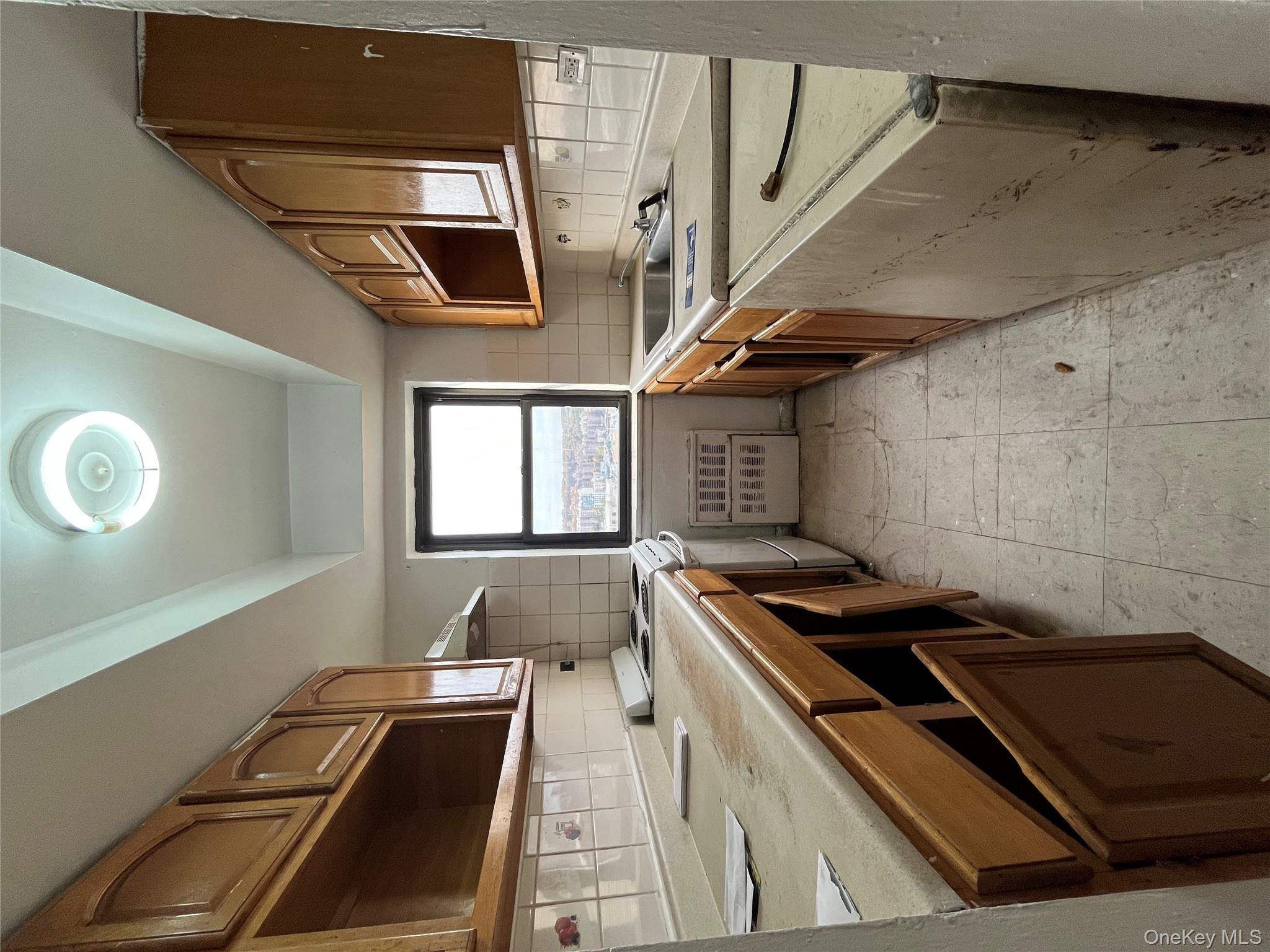2545 Sedgwick Avenue, Unit 7B Bronx, NY 10468 - Photo 10 of 20 a kitchen with stainless steel appliances granite countertop a sink and a stove