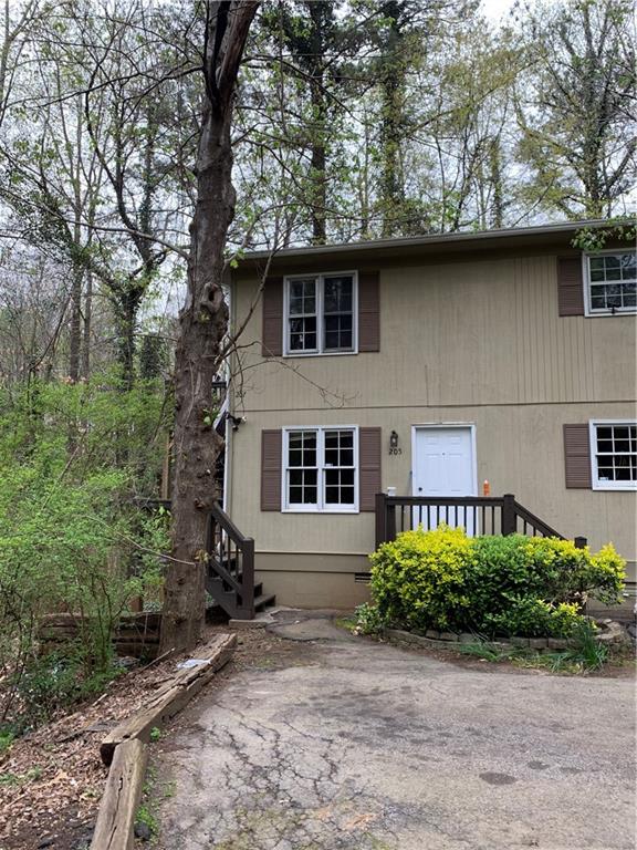 a house with trees in the background