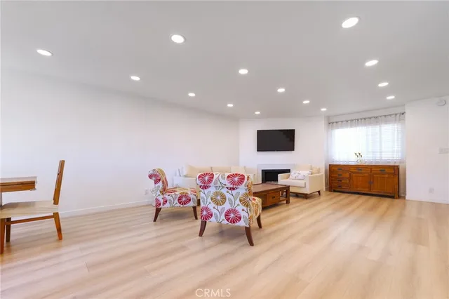 a view of a swimming pool with outdoor seating