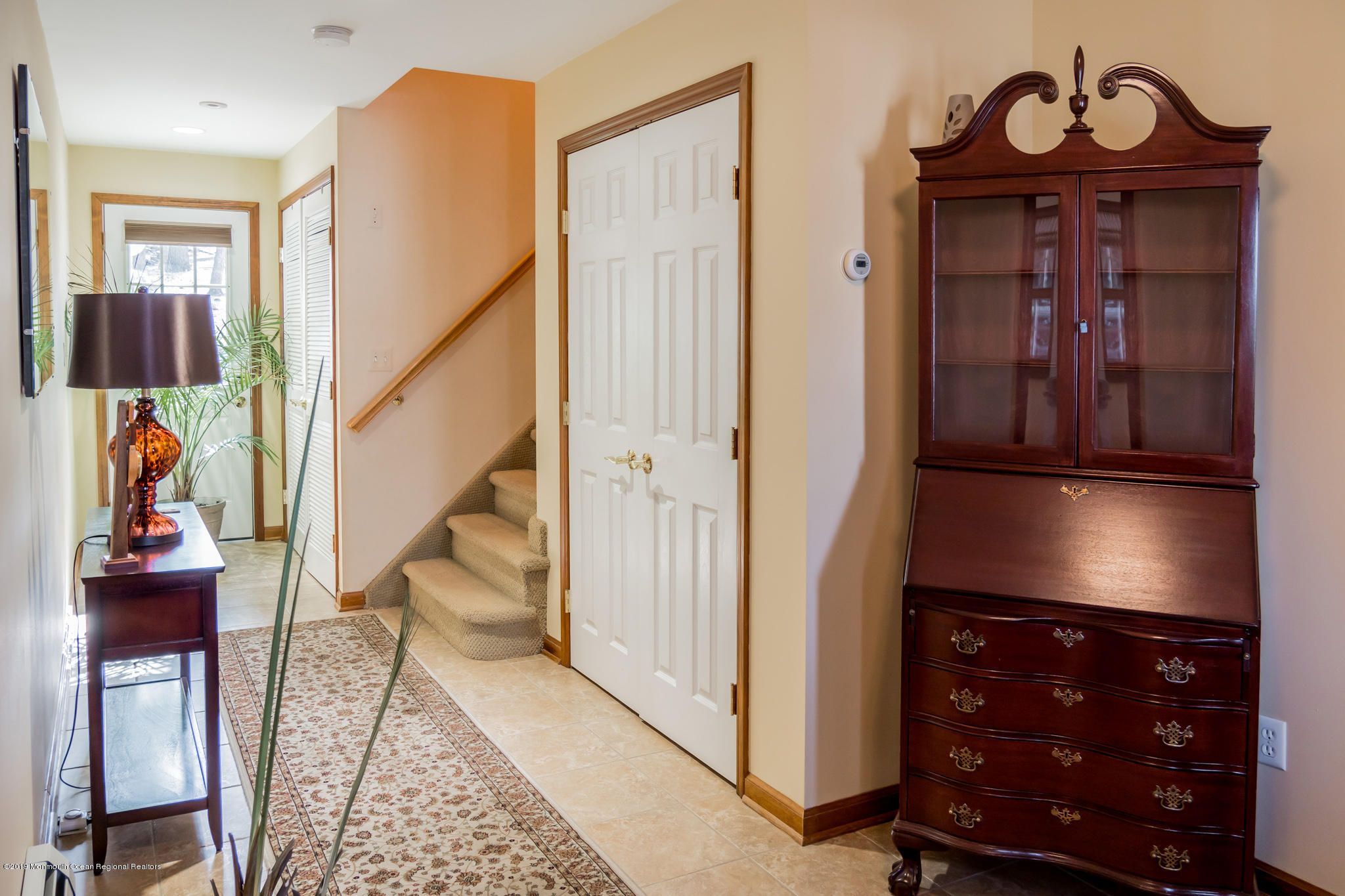 20 Ridge Road Hopatcong, NJ 07843 - Photo 2 of 30 a view of a hallway with entryway wooden floor and a livingroom view