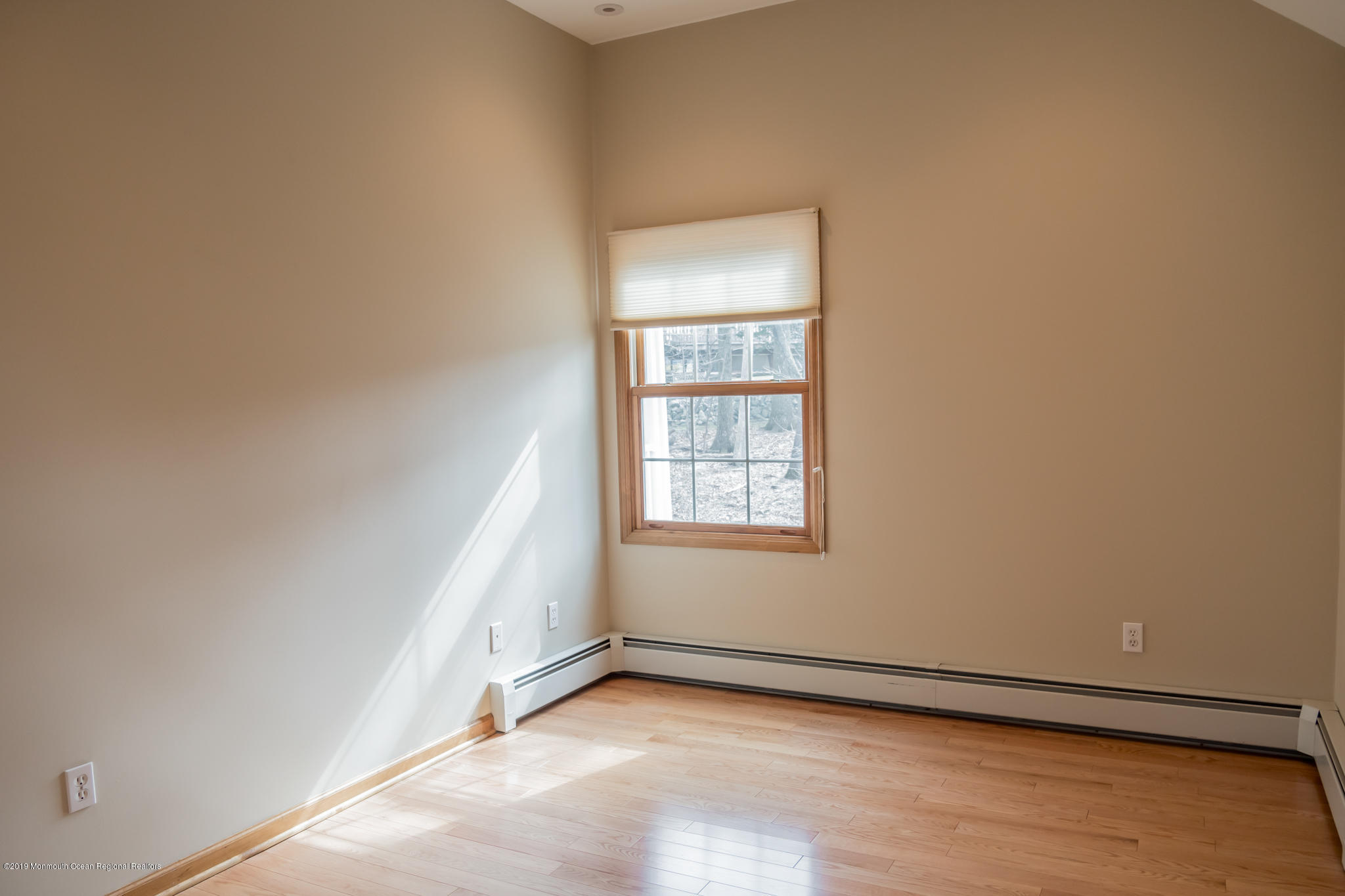 20 Ridge Road Hopatcong, NJ 07843 - Photo 21 of 30 an empty room with wooden floor and windows