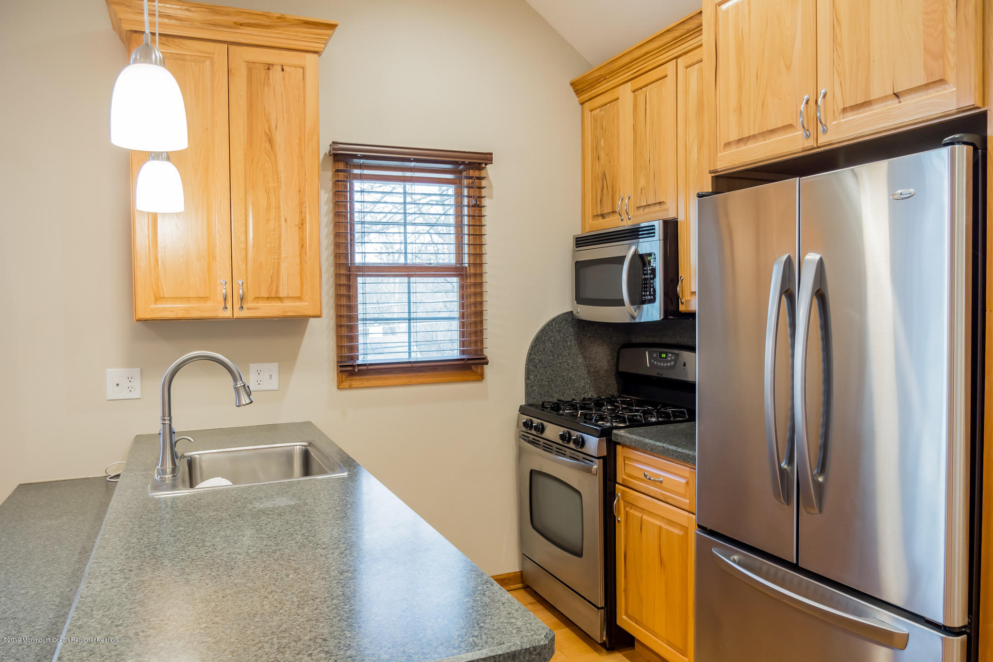 20 Ridge Road Hopatcong, NJ 07843 - Photo 25 of 30 a kitchen with granite countertop a refrigerator and a sink