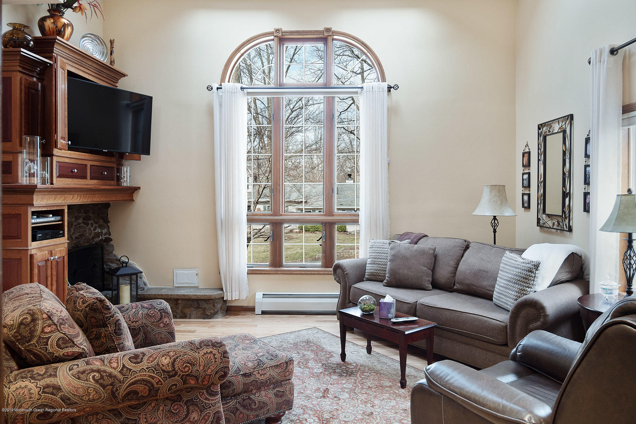 20 Ridge Road Hopatcong, NJ 07843 - Photo 5 of 30 a living room with furniture a flat screen tv and a window