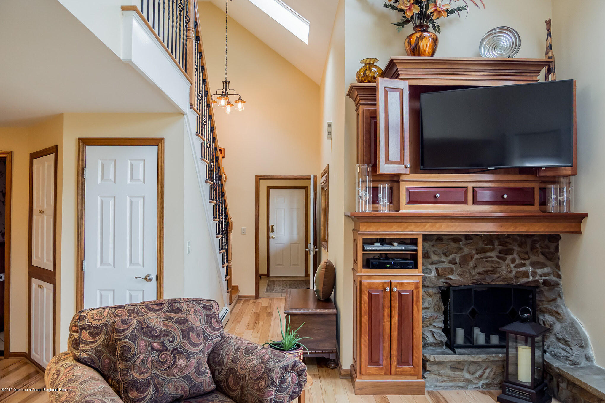 20 Ridge Road Hopatcong, NJ 07843 - Photo 6 of 30 a living room with fireplace and a flat screen tv
