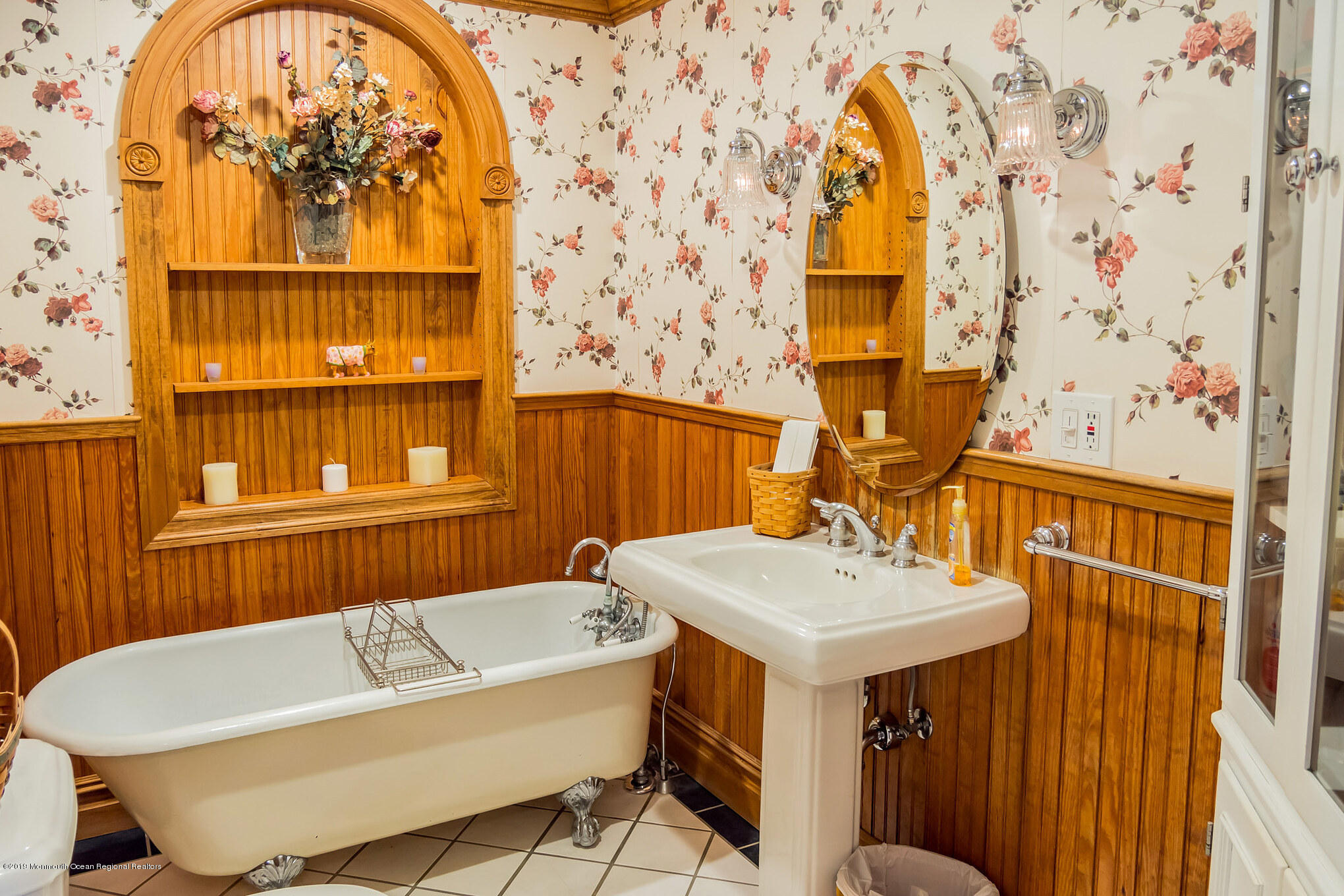20 Ridge Road Hopatcong, NJ 07843 - Photo 7 of 30 a bathroom with a sink a mirror and a bathtub