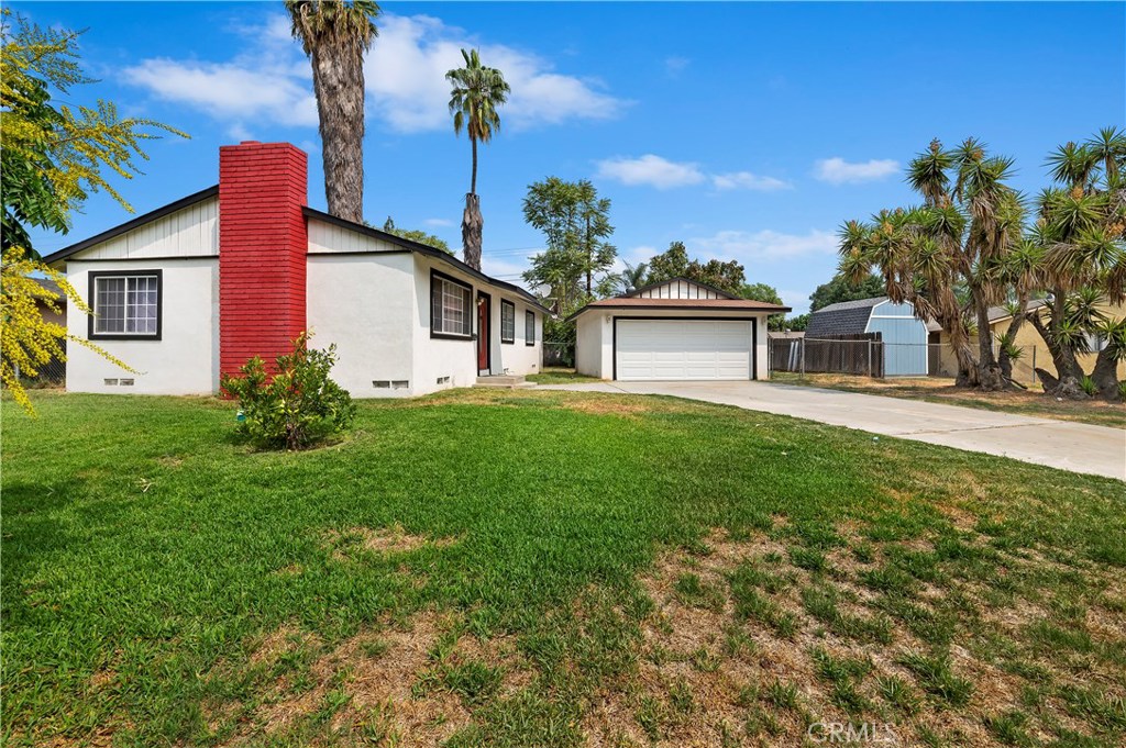 3851 Ogden Way Riverside, CA 92501 - Photo 1 of 1 a front view of a house with garden