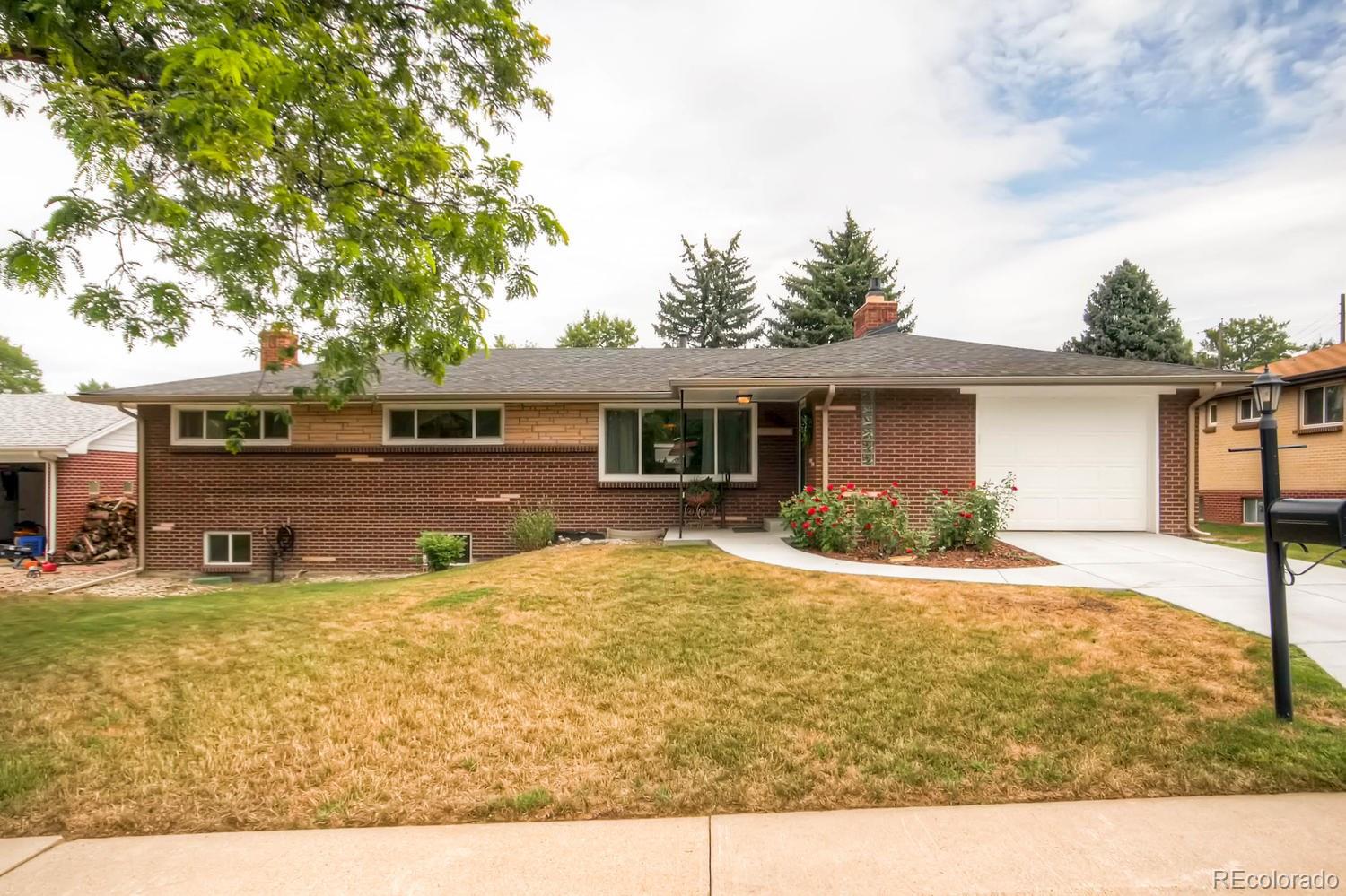 a view of a house with swimming pool and sitting area