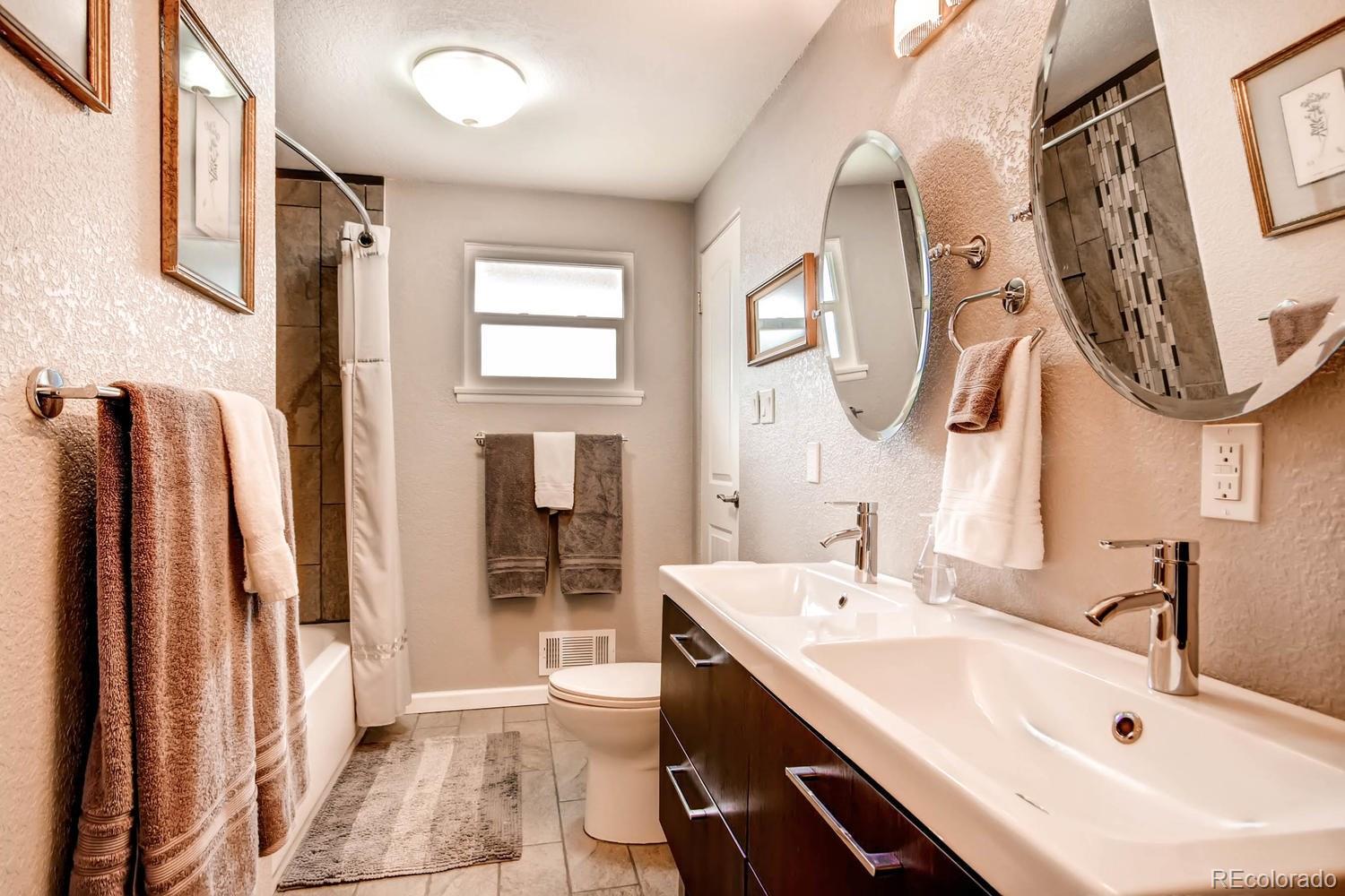 3660 Hoyt Court Wheat Ridge, CO 80033 - Photo 13 of 28 a bathroom with a sink and a mirror