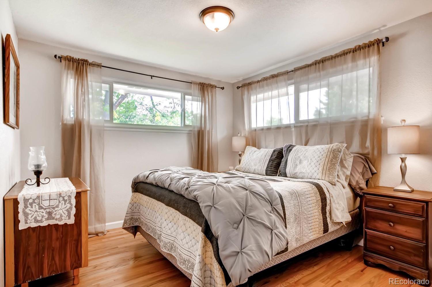 3660 Hoyt Court Wheat Ridge, CO 80033 - Photo 17 of 28 a bedroom with a bed and window