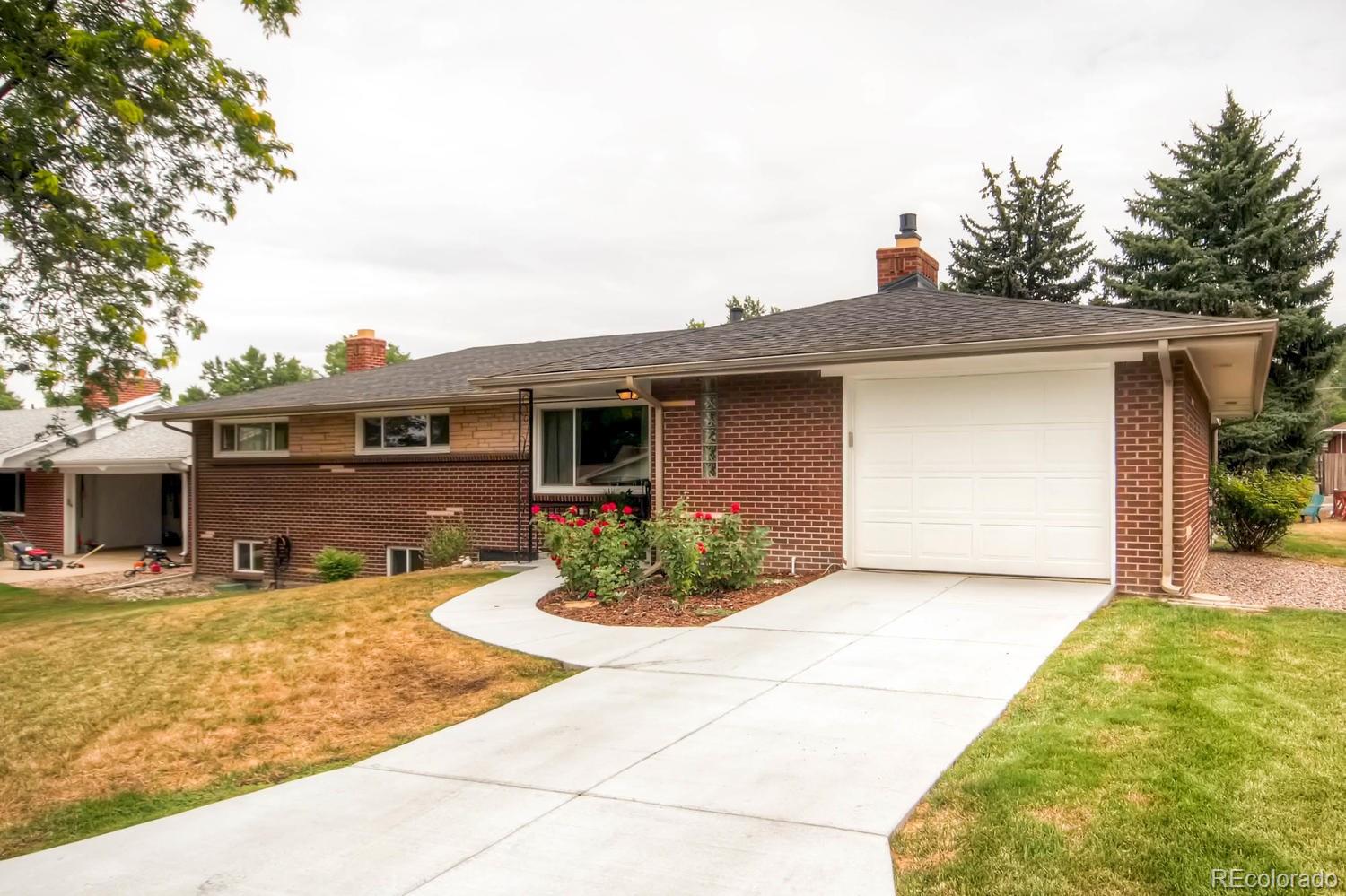 3660 Hoyt Court Wheat Ridge, CO 80033 - Photo 2 of 28 a front view of a house with a yard