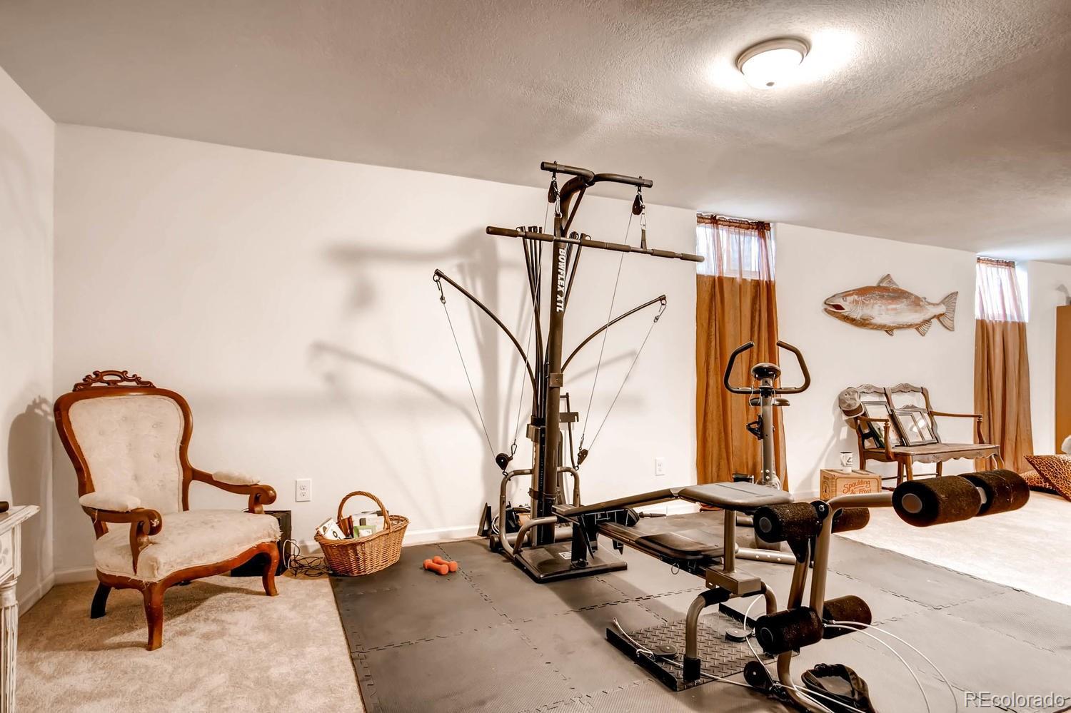 3660 Hoyt Court Wheat Ridge, CO 80033 - Photo 21 of 28 a view of a room with gym equipment