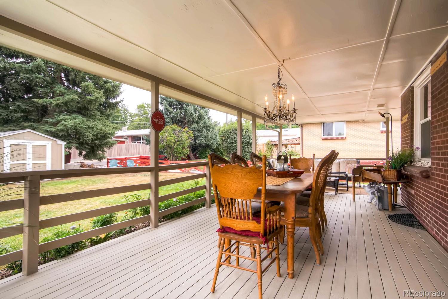 3660 Hoyt Court Wheat Ridge, CO 80033 - Photo 23 of 28 a view of a dining room with furniture window and wooden floor