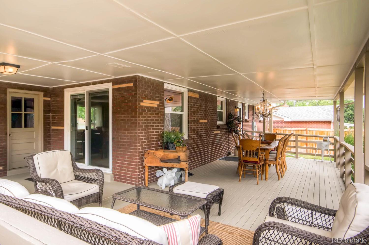 3660 Hoyt Court Wheat Ridge, CO 80033 - Photo 25 of 28 a outdoor living space with furniture and a flat screen tv